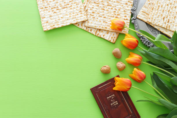 istock Pesah celebration concept (jewish Passover holiday). Traditional book with text in hebrew: Passover Haggadah (Passover Tale) 1135337745
