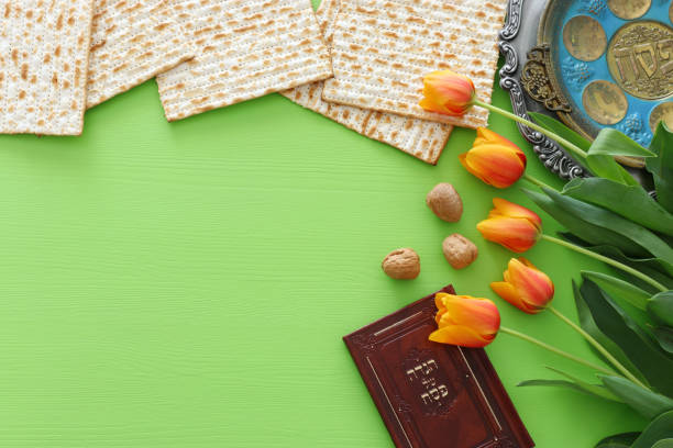 istock Pesah celebration concept (jewish Passover holiday). Traditional book with text in hebrew: Passover Haggadah (Passover Tale) 1135337746