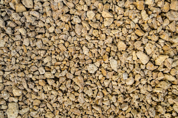 istock Yellow fine crushed stone coquina backgrond 1135339878