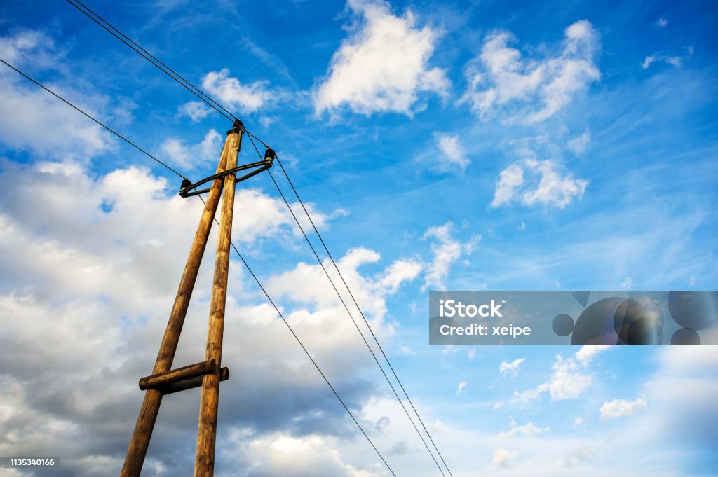 Mast of a power line with sky in the evening Austria Stock Photo