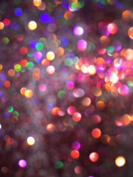 istock Multicolored bokeh and Christmas defocused light background 1135343418