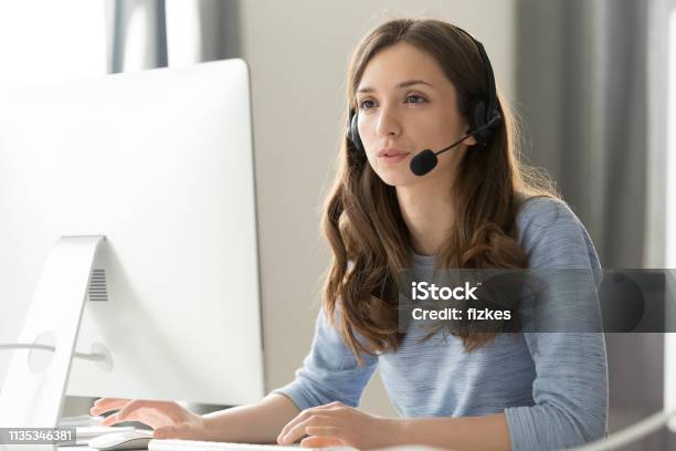 Businesswoman In Headset Call Center Agent Consulting Participating Video Conference Stock Photo - Download Image Now