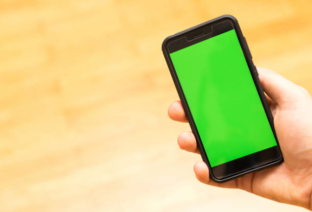istock Male hand with Smartphone. Chroma key. Place for your advertisement. 1135346488
