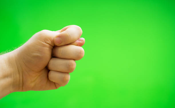 istock Male hand shows fig sign. Chroma key. Place for your advertisement. 1135346497