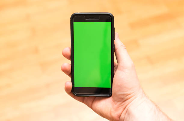 istock Male hand with Smartphone. Chroma key. Place for your advertisement. 1135346509