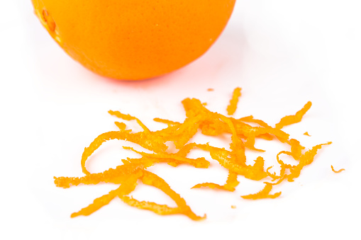Orange and peel parts, white background