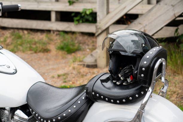 istock Biker helmet on a bike seat 1135348678