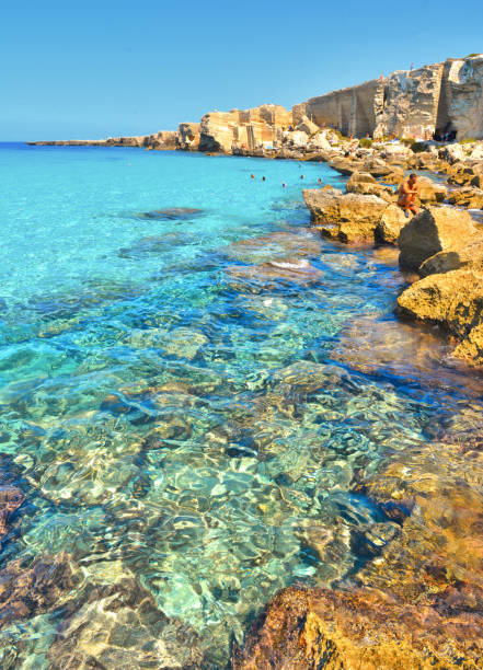Seascape with torquoise blue water in Favignana island, Cala Rossa Beach, Sicily South Italy. 02.09.2018. Seascape with paradise clear torquoise blue water in Favignana island, Cala Rossa Beach, Sicily South Italy. egadi islands photos stock pictures, royalty-free photos & images