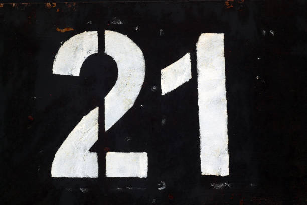 istock Number 21 in stencil on black metal wall. 1135350609