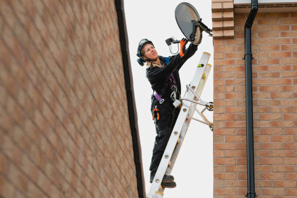 istock Female Engineer Fixing an Aerial 1135350898