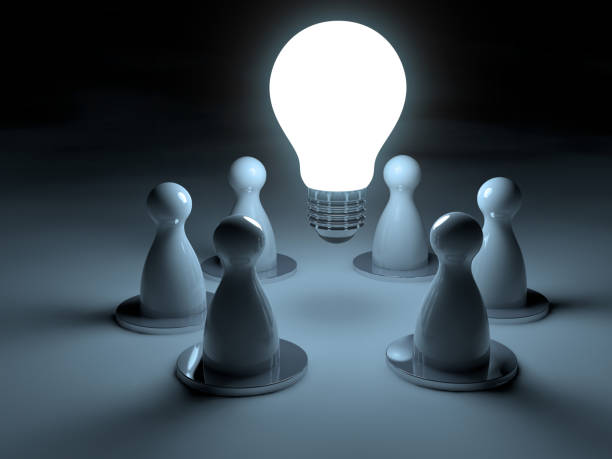 istock light bulb and pawns, inspiration concept 1135355582