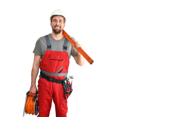 istock cheerful construction worker - craftsman in working clothes with a spirit level on white background 1135355706