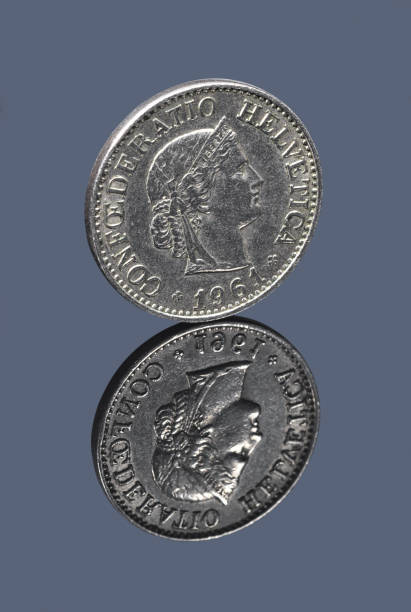 istock Switzerland ten centimes coin on gray mirror surface 1135356678