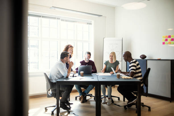 istock Designers discussing work during a meeting in an office 1135358702
