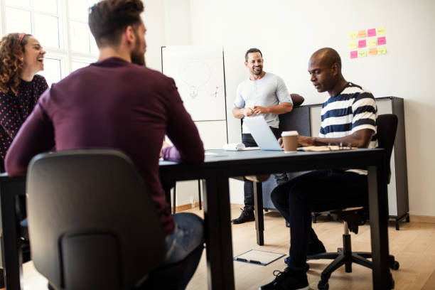 istock Diverse colleagues working together during a boardroom presentation 1135358812