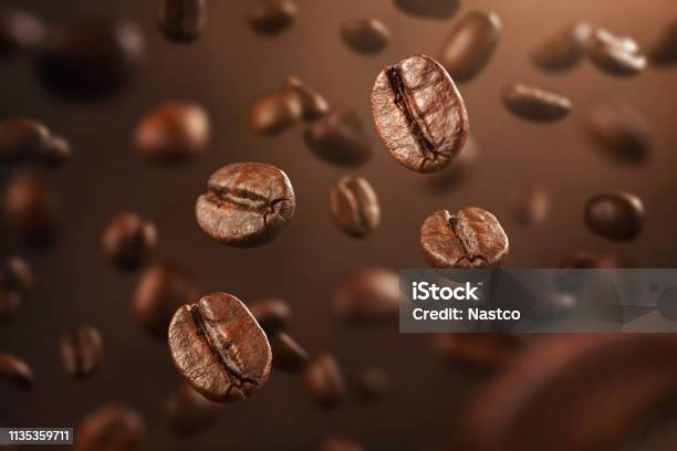 Roasted Coffee Beans Falling Down Stock Photo - Download Image Now - Coffee - Drink, Roasted Coffee Bean, Raw Coffee Bean