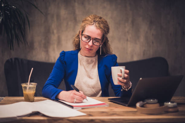istock Beautiful female drinking coffee in cafeteria. 1135361963