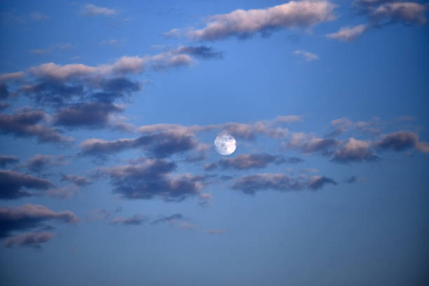 istock Moon and clouds in the evening sky 1135363848
