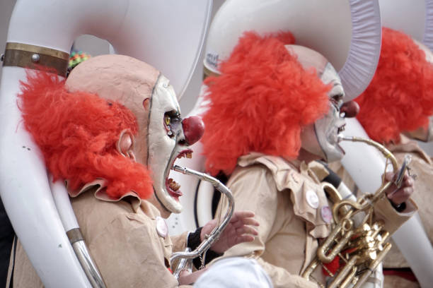 Three brass players at the fasnacht carnival parade at Basel, Switzerland.