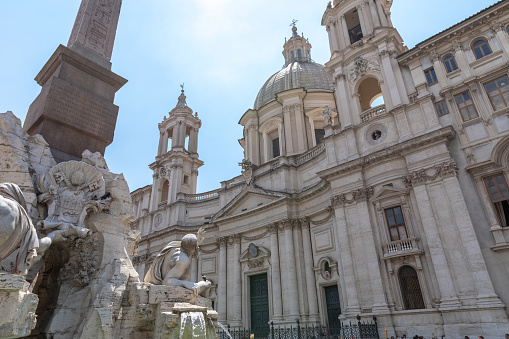 Rome, Italy - June 21, 2018: Panoramic view of church Sant'Agnese in Agone, also called Sant'Agnese in Piazza Navona is a square in Rome. Summer day and blue sky