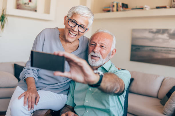 istock Senior couple taking a selfie 1135369782