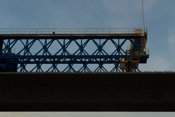 istock Silhouette of heavy motorway construction machine. 1135369975