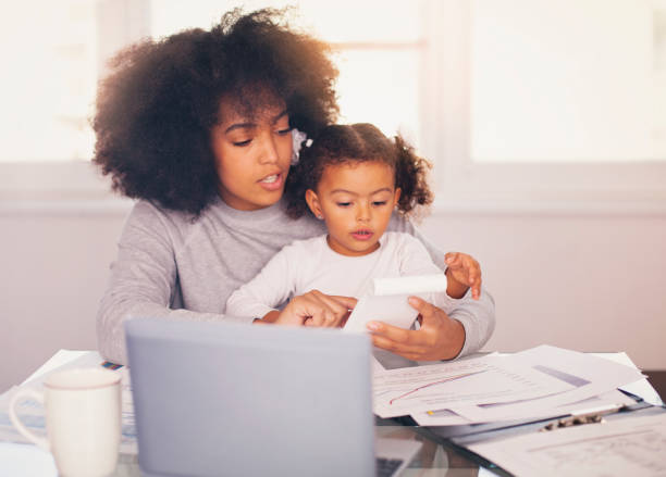 istock Young mother working and spending time with her daughter 1135372239