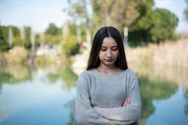 Serious Young Woman With Arms Crossed.
