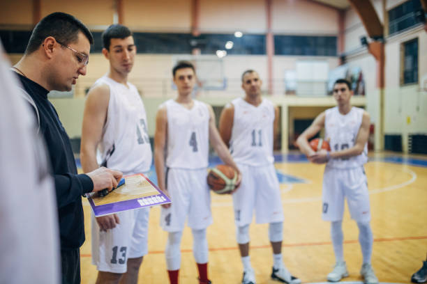 istock Coach talking to a basketball players 1135372956