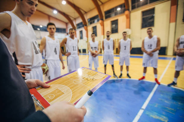 istock Coach talking to a basketball players 1135373295
