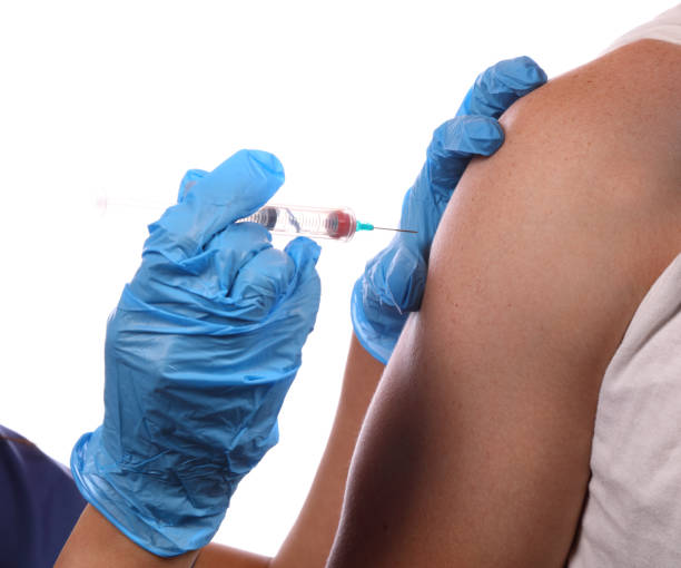 istock Medical Staff Gives Flu Shot MS 1135374161