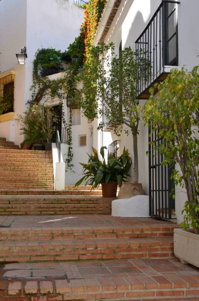 Clay stairway in landscaped street in Benahavis, a  mountain village next to Marbella, Andalusia, Spain.