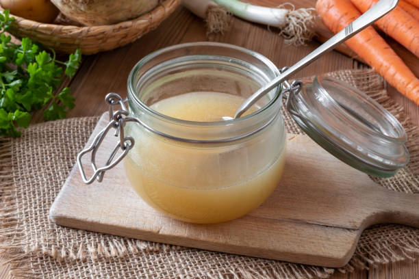 istock Chicken bone broth in a glass jar 1135376463