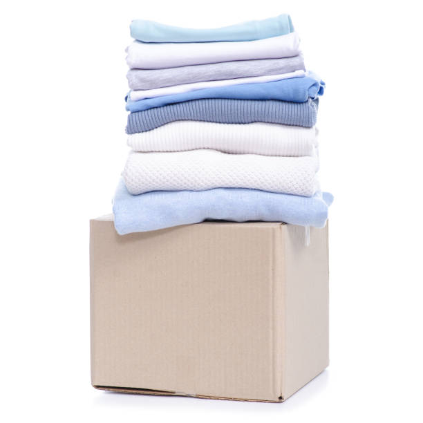 istock Stack of clothing in cardboard box 1135376733