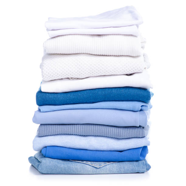 istock Stack blue jeans and white blue shirt, sweater, t-shirt clothes 1135376851