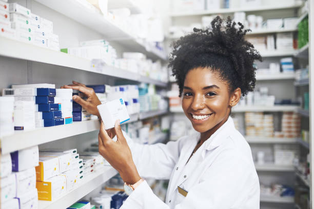 She knows what works best Cropped shot of a female pharmacist taking a product from the shelves healthcare and medicine business hospital variation stock pictures, royalty-free photos & images