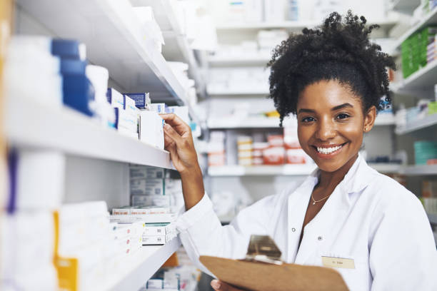 Making sure the shelves are always fully stocked Cropped shot of a female pharmacist holding a clipboard healthcare and medicine business hospital variation stock pictures, royalty-free photos & images