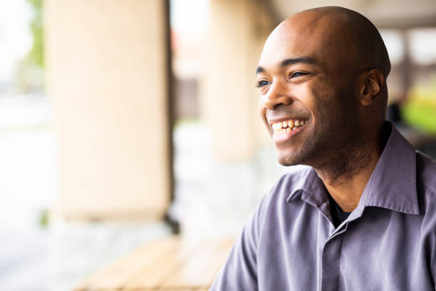 istock Portrait of a young black man outdoors smiling 1135381187