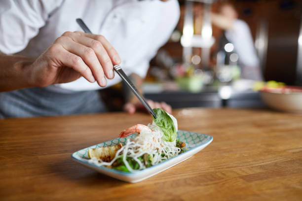 istock Chef Decorating Gourmet Dish Closeup 1135382308