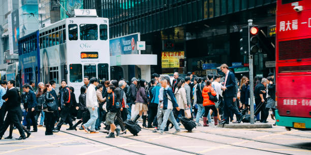 istock Hong Kong crowd commuter crossing crosswalk rush hour 1135382440