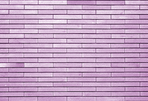 Full frame colorfully painted brick wall texture from a building