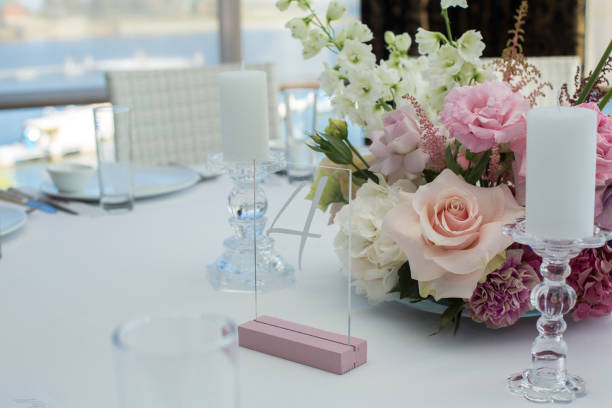 istock Event white restaurant table served and decorated with delicate fresh flowers 1135382679
