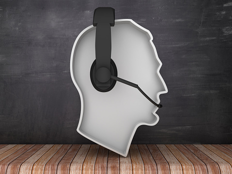 Human Head Shape with Headset on Chalkboard Background - 3D Rendering
