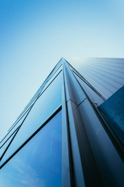 blue skyscraper out of glass - window sun sunlight vertical imagens e fotografias de stock