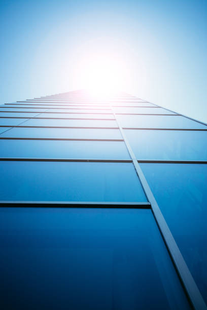 istock Blue skyscraper out of glass, sunbeam 1135384041