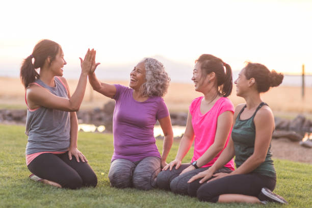 istock Four ethnic women high-five after a vigorous outdoor workout 1135385111