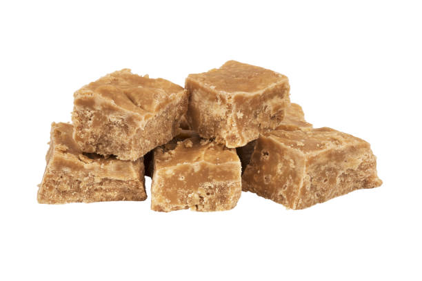 istock Close up on homemade sugar cream square, isolated on white background. 1135387072