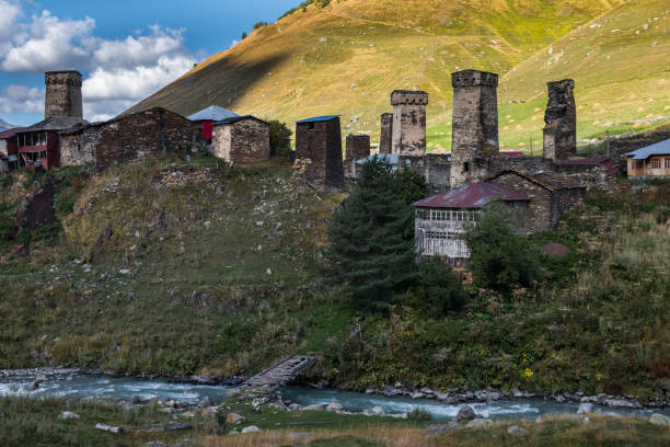 istock Mountain Murkmeli village in Ushguli community with river under it and bridge and sunny meadows 1135387716