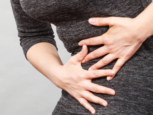 istock Woman having strong stomach ache. Syndroms 1135389700