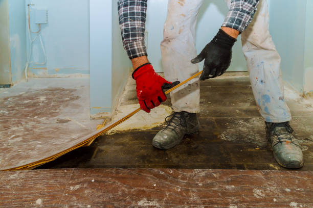 istock Handyman during work of removing oldlaminated parquet flooring 1135393632